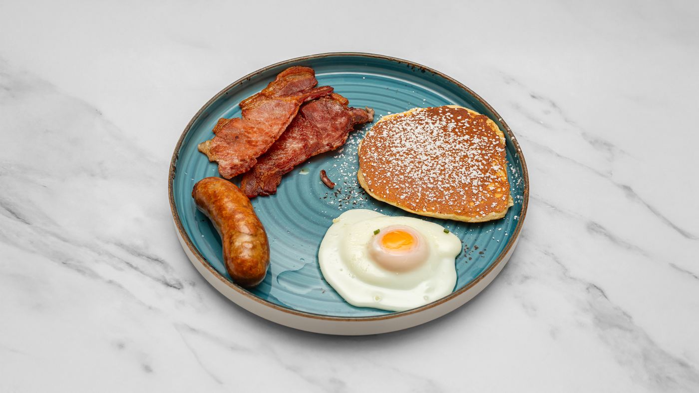 The American Break — pancakes, fried egg, bacon and sausage at Caffe Nova